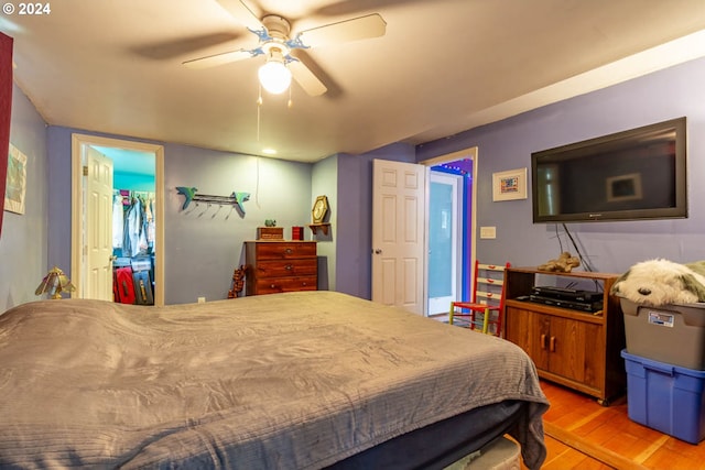 bedroom with ceiling fan and light wood-type flooring