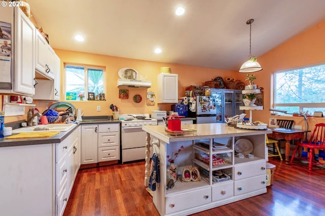 kitchen featuring decorative light fixtures, a kitchen island, white cabinets, dark hardwood / wood-style flooring, and white range with electric cooktop