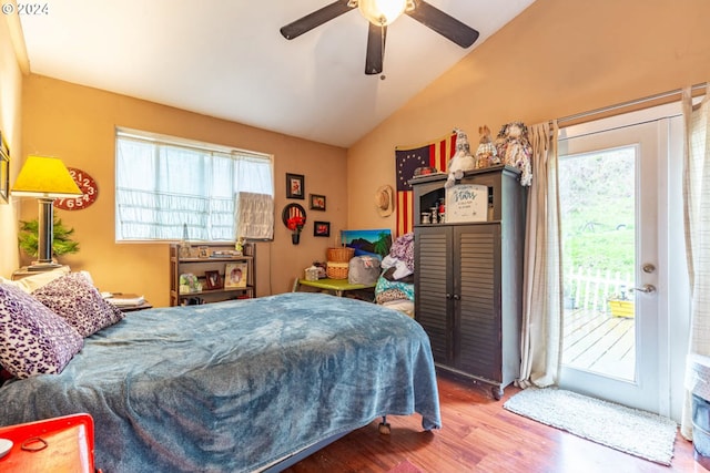 bedroom featuring lofted ceiling, wood-type flooring, access to exterior, and ceiling fan