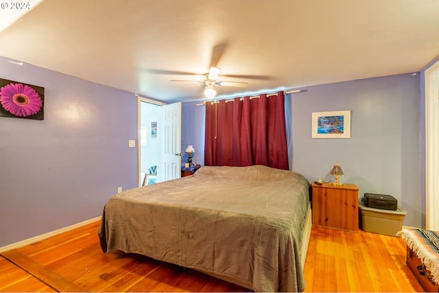 bedroom featuring ceiling fan and wood-type flooring