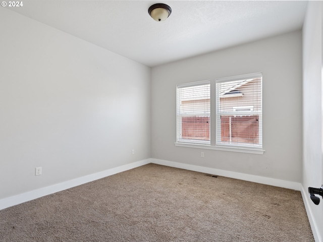 spare room featuring carpet flooring