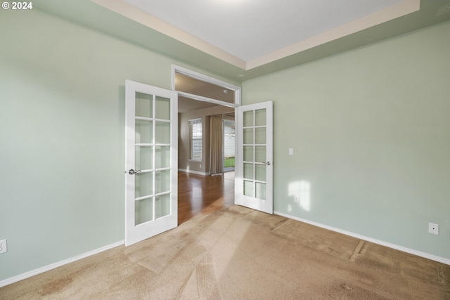 empty room with carpet and french doors