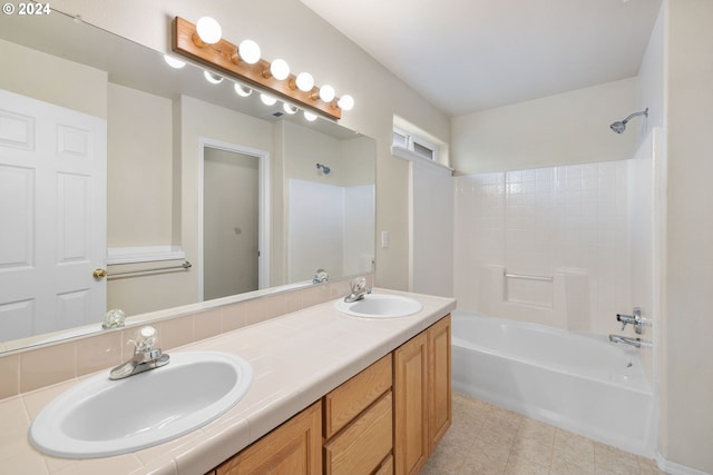 bathroom with vanity and washtub / shower combination