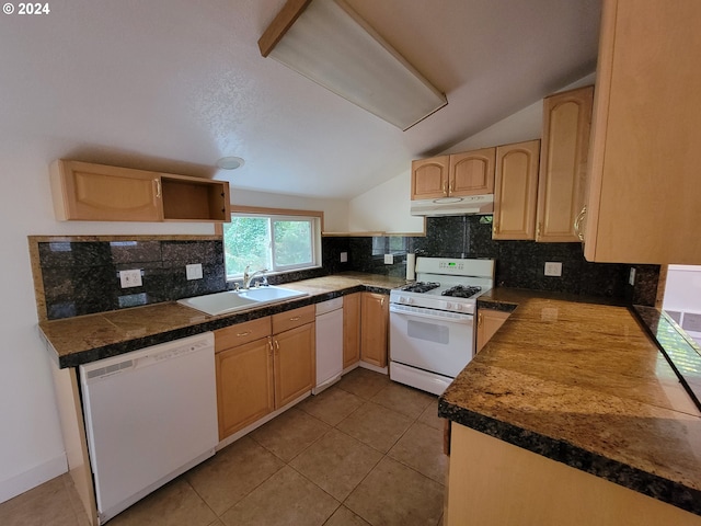 kitchen featuring lofted ceiling, sink, light brown cabinetry, white appliances, and tasteful backsplash