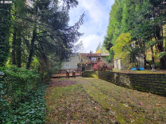 view of yard featuring a wooden deck