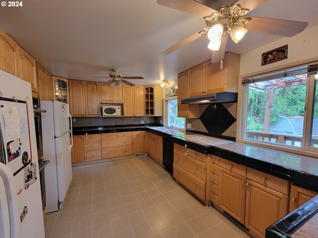 kitchen with ceiling fan, sink, backsplash, and white appliances