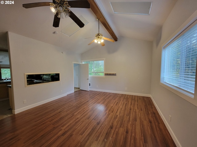 unfurnished living room featuring lofted ceiling with beams, hardwood / wood-style flooring, and ceiling fan