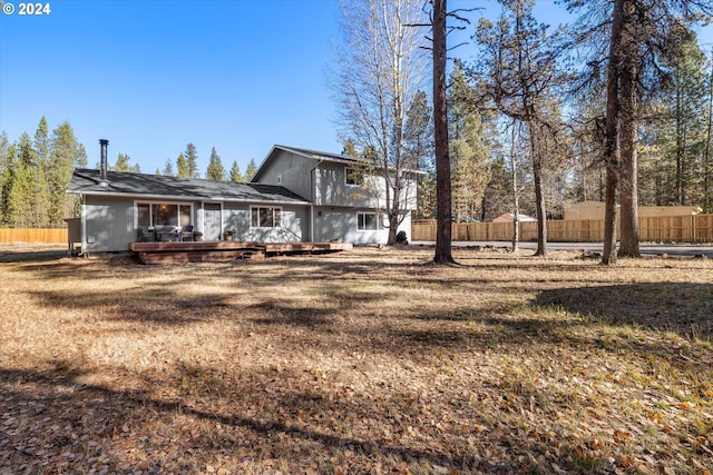 rear view of property with a deck