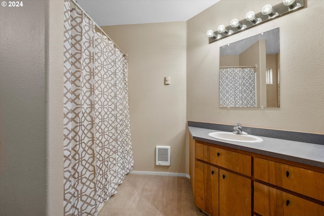 bathroom featuring vanity and heating unit