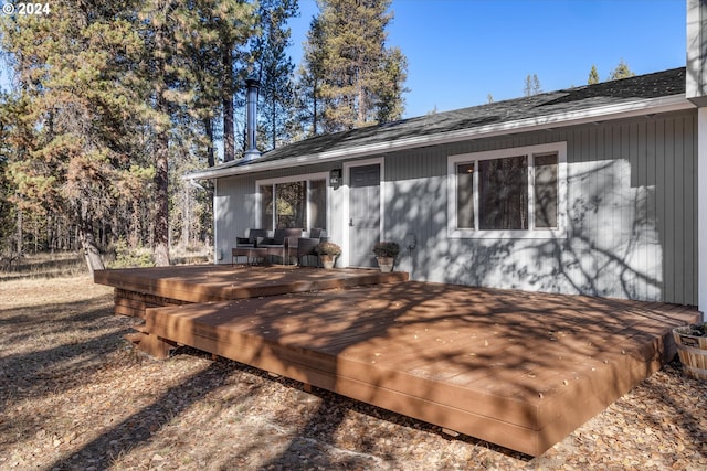 back of property featuring a deck