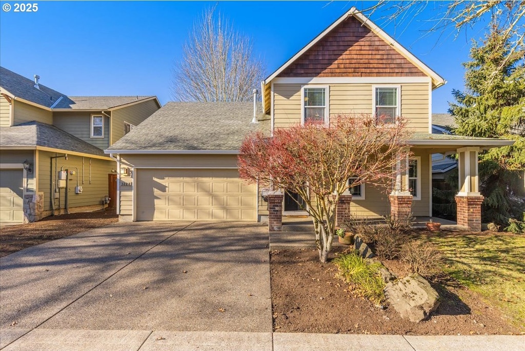 front facade with a garage and a porch