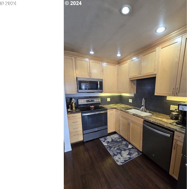 kitchen featuring stainless steel appliances, dark hardwood / wood-style floors, sink, and light brown cabinets