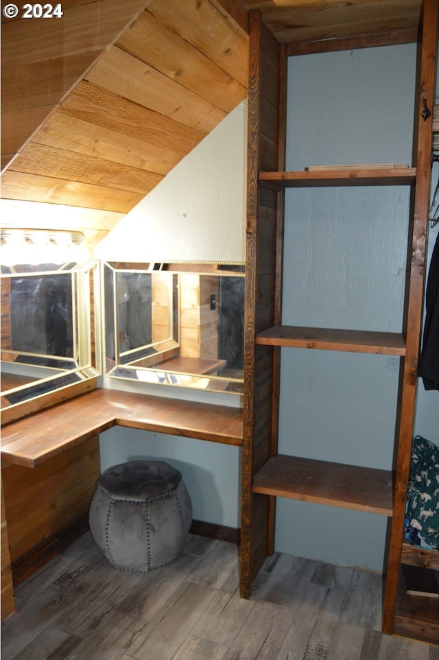 interior space featuring hardwood / wood-style floors and wooden ceiling