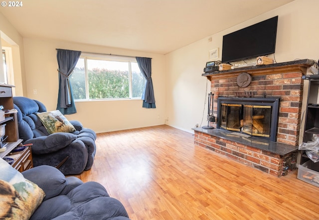 living room featuring hardwood / wood-style floors and a fireplace