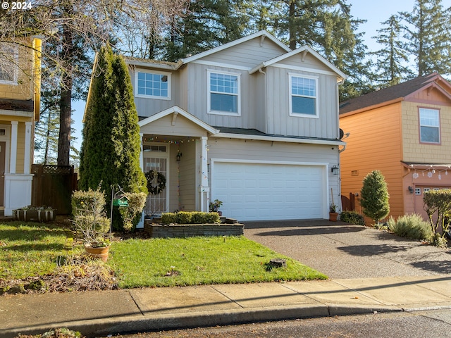 view of front of home with a garage and a front lawn