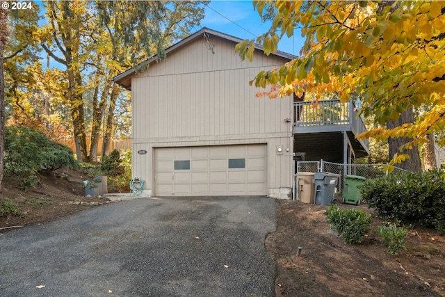 view of side of home featuring a garage