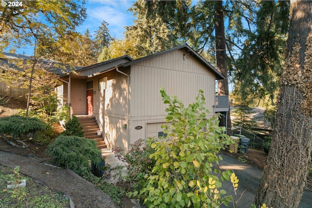 view of side of home with a garage