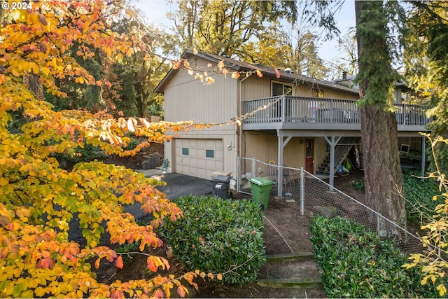 16081 Pearcy St, Lake Oswego, OR 97034 - rear view of property featuring stairway, driveway, a wooden deck, a garage, and fence