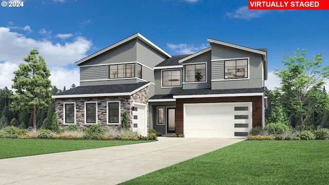 view of front of house with a garage and a front yard