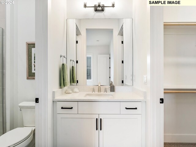 bathroom with vanity and toilet