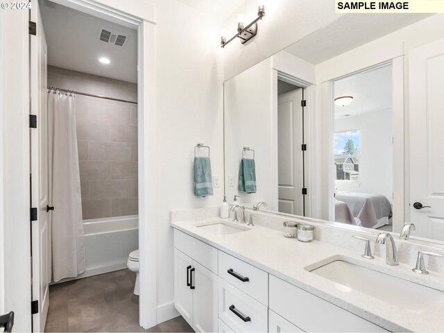 full bathroom featuring tile flooring, large vanity, double sink, toilet, and shower / bathtub combination with curtain