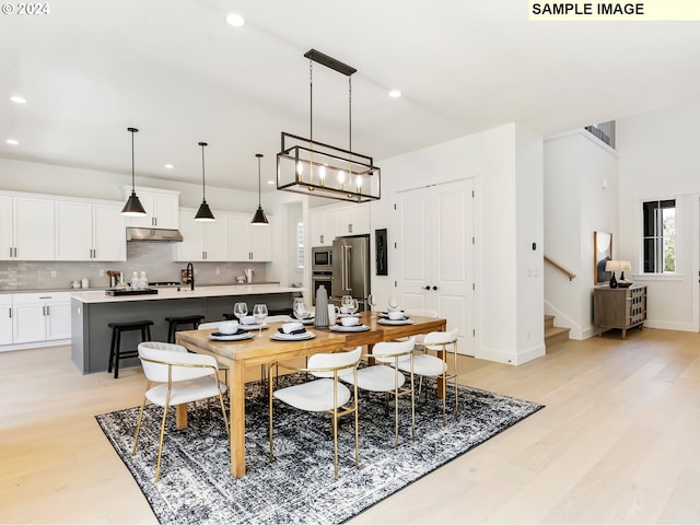 dining area with light wood-type flooring