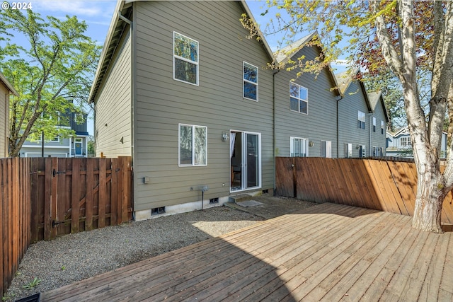 rear view of property with a wooden deck