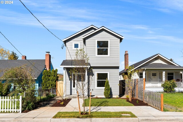 view of front of property with a front lawn and a porch