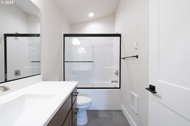 full bathroom with toilet, vanity, and bath / shower combo with glass door