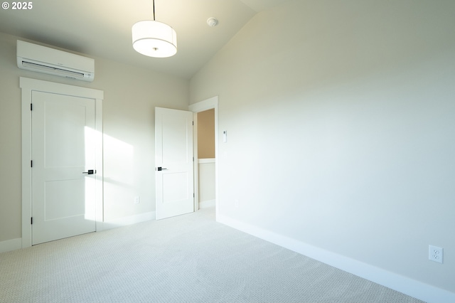 unfurnished bedroom featuring light colored carpet, lofted ceiling, and a wall mounted AC