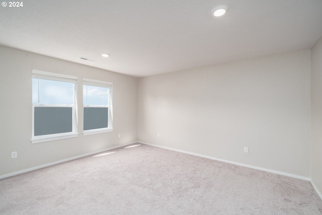 empty room featuring carpet flooring