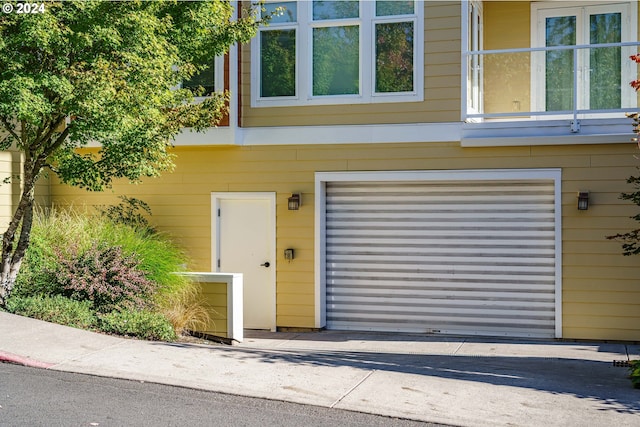 view of exterior entry with a garage