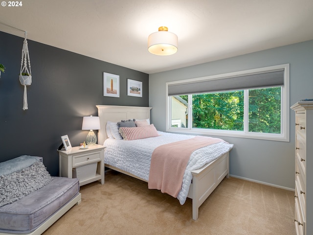 bedroom with light colored carpet