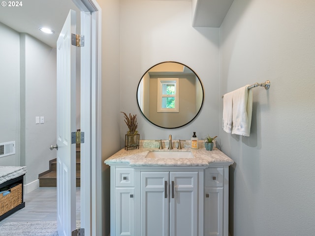 bathroom with vanity and wood-type flooring