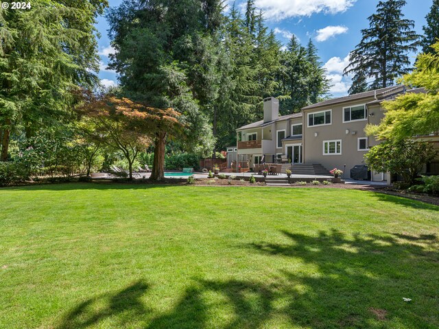 view of yard featuring a wooden deck