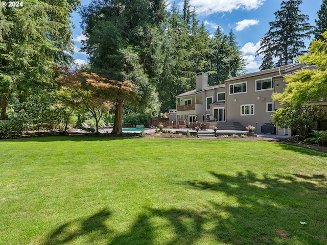 view of yard with a wooden deck