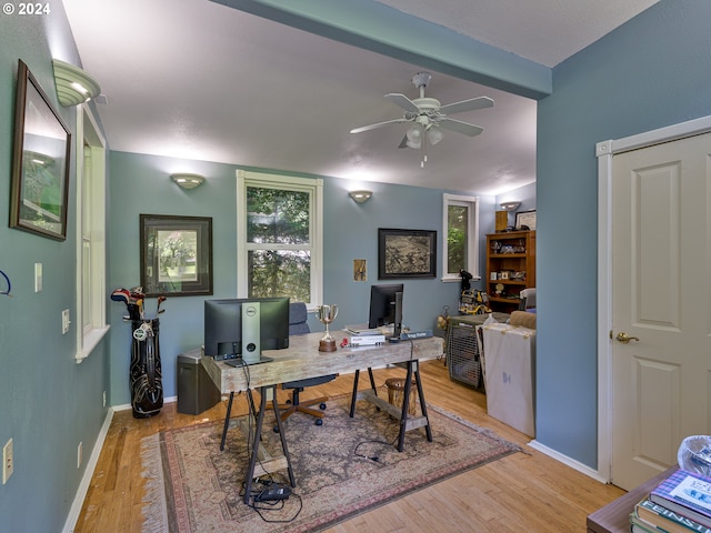 office with ceiling fan, light hardwood / wood-style flooring, and lofted ceiling