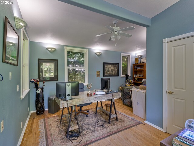 office with lofted ceiling with beams, ceiling fan, and light hardwood / wood-style floors