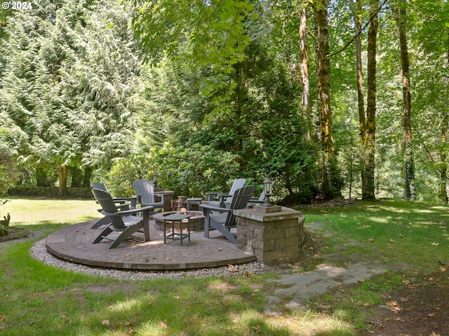 view of yard with an outdoor fire pit