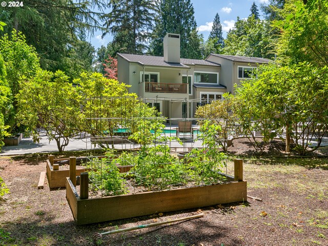 rear view of house with a balcony