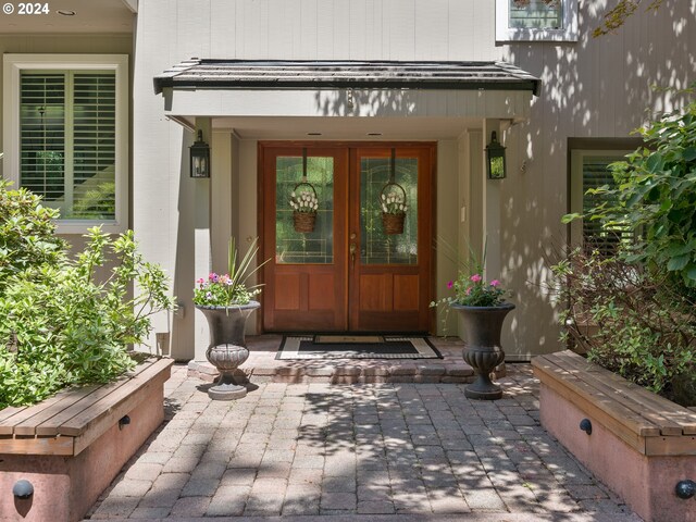 entrance to property with french doors and a patio area