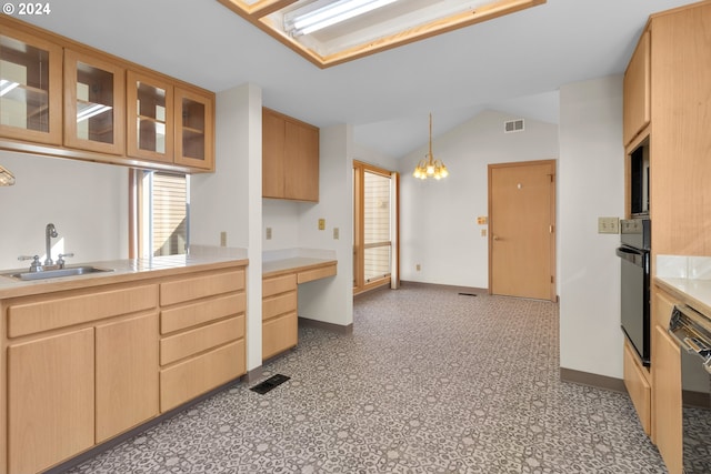 kitchen featuring lofted ceiling, hanging light fixtures, sink, black appliances, and light brown cabinetry