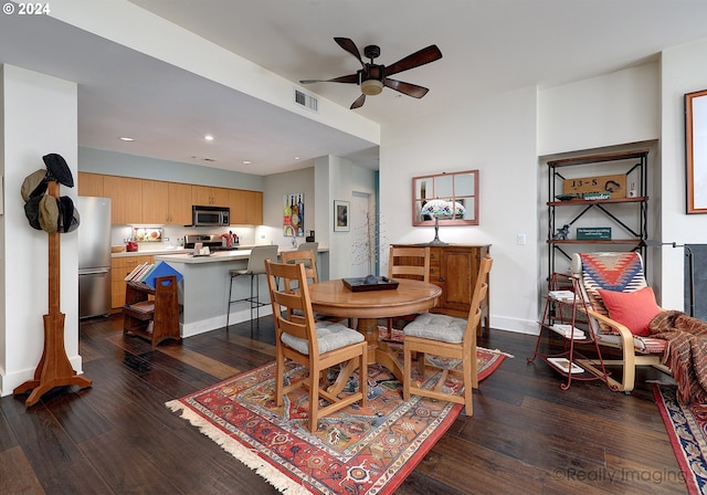 dining space with dark hardwood / wood-style flooring and ceiling fan