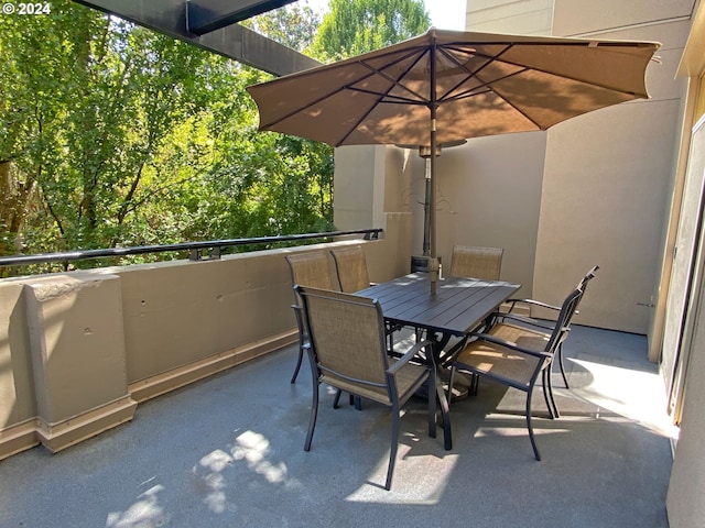 view of patio featuring a balcony