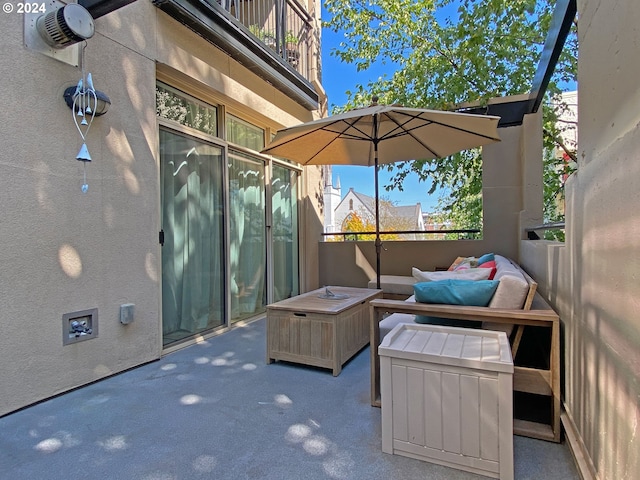 view of patio / terrace with an outdoor living space with a fire pit