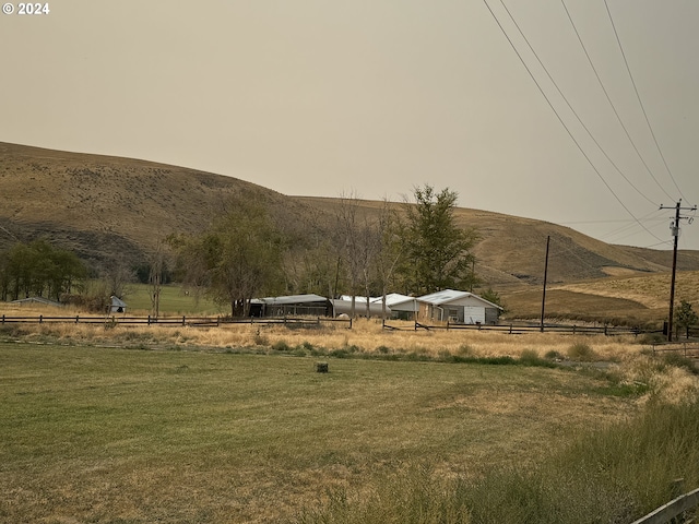 property view of mountains featuring a rural view