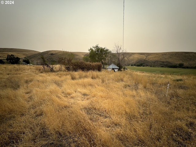 view of landscape with a mountain view and a rural view