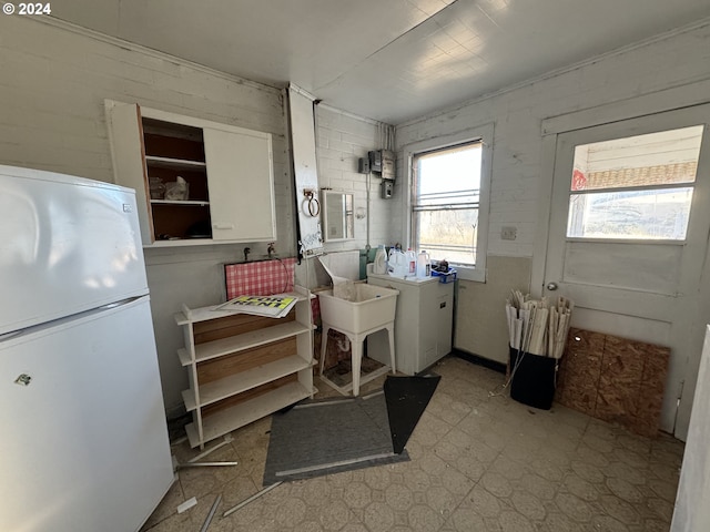 66350 Upper Rock Creek Rd, Arlington, OR 97812 - clothes washing area featuring light floors, a sink, and laundry area