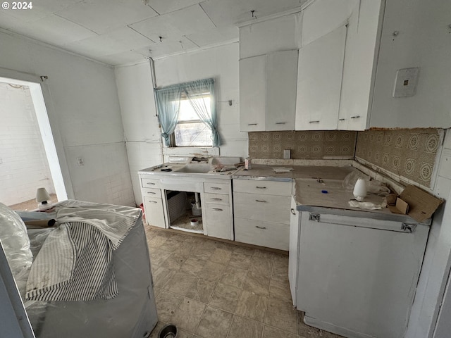 kitchen with sink and white cabinets