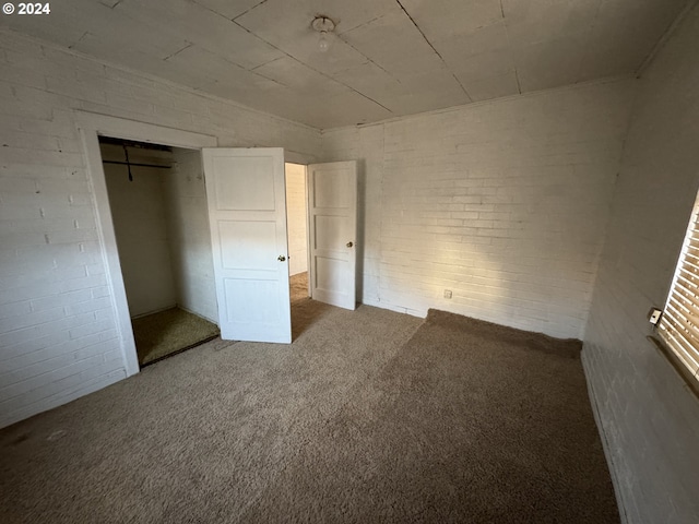 unfurnished bedroom with a closet and carpet floors